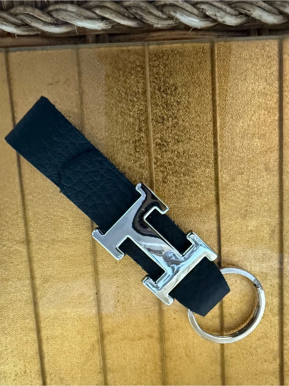 “H” chrome and black leather keychain